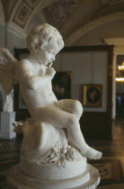 The Hermitage Museum  interior of a gallery  cherub statue in foreground