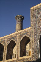 Tillya-Kari Madrassah Mosque exterior detail of ornate wall archways and tower