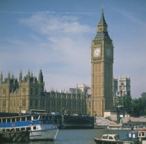 Houses of Parliament Big Ben with the River Thames & boats in the foreground