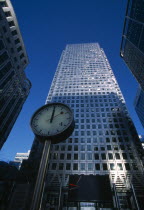 Canary Wharf. The tower at 1 Canada Square with clock in the foreground.