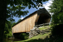 Corbin Bridge  wooden covered bridge  going over water.  streamriver  streamriver