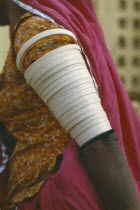 Cropped view of woman wearing multiple armbands.