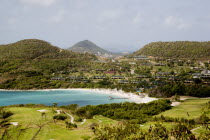 Jambu Beach at Raffles Resort and the Trump International Golf Course with Union Island in the distance