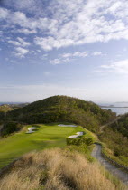 Raffles Resort showing the 12th green on the Trump International Golf course with the southern Grenadine islands in the distance