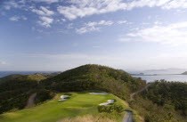 Raffles Resort showing the 12th green on the Trump International Golf course with the southern Grenadine islands in the distance