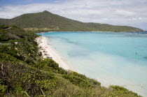 Godahl beach at Raffles Resort with Mount Royal on the horizon