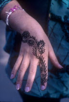 Close up of womans hand decorated with Henna in preperation for a wedding