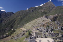 View across the ruins towards surrounding mountains.