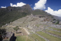 View across the ruins towards surrounding mountains.