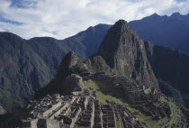 View over ruined Inca city and surrounding mountain landscape