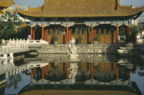 Pavilion in the Park reflected in pool in the foregroundAsia Chinese Chungkuo Jhongguo Zhonggu Asian History Jhonggu Pavillion