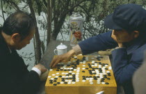 Men playing Go