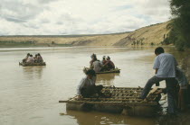 People traveling down river on Hide Raft