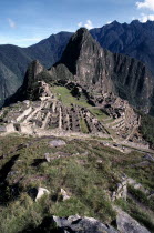 General view over the Inca ruins set in rocky mountain landscape