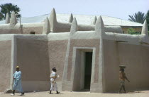 Traditional Building with local people walking by