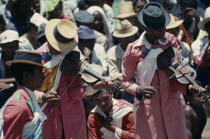 Traditional folk musicians playing to crowds.