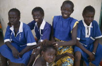 Group of teenage girls wearing school uniforms