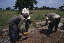 Men building rural school.