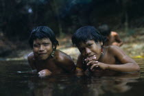 Children in the water with beaded body decorations Brasil