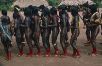 The Indians dance to celebrate reclaiming their land. They have red and black died skin decoration.Brasil Kreen Akore