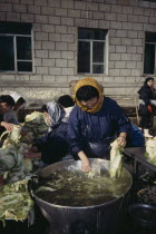 Women preparing Kimqi the national pickled cabbage dish