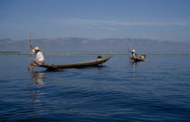 Fishermen with narrow wooden canoes. Burma