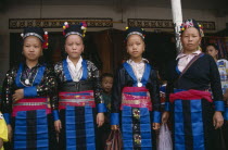 Four Hmong girls in traditional dress.