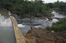 Dam built by local woman Pauline Rerimoi.  Previously she had had to carry a twenty litre container of water along cliff paths in a four hour trip.