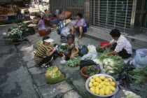 Women street vendors selling fruit and vegetables and kimchi in east coast fishing port.