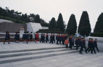 Group of children visiting the Tomb of the Martyrs outside the city.