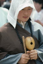 Portrait of young woman at Buddhist dance.