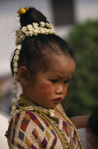 Portrait of young girl dressed for New Year celebrations.