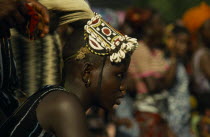 Woman with head dress made of shells