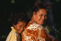 Near Vaipae. Portrait of smiling mother and daughter