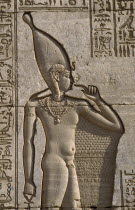 Temple of Hathor.  Detail of relief carving of the divine infant Ihy on the Roman Mammisi or birth house temple.