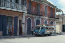 Street scene with typical colonial style architecture and bus.