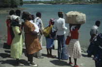 Group of men and women waiting for ferry.East Africa