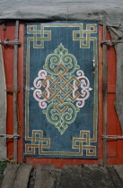 Painted wooden door of yurt.  Ger  Ger