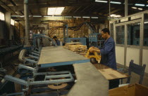 Worker in air filter factory