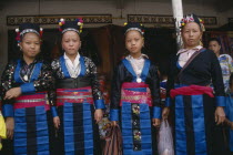 Four Hmong women in traditional dress