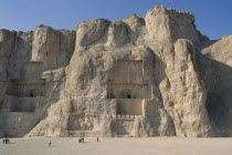 Naghshe e Rostam near Persepolis. Achaemenian Tombs with visitors walking around