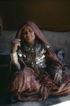 Portrait of woman of the Jajia tribe wearing traditional dress and jewellery.