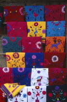 Brightly coloured embroidered local textiles. Colored