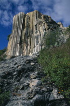 Cliff formed by limestone deposits from mineral springsColorful