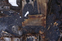 Detail of Scotts hut exterior with a list of fruit written on a broken piece of wooden crate