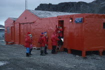 Teniente Marsh Station. Tourists wearing red jackets outside Post Office