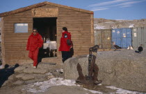 Men in red jackets outside a coffee shop at station of Italian Antarctic Programme Store