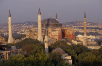 Dome and minarets of Haghia Sophia amongst rooftops of the Sultanahmet.  Former mosque now museum.EurasiaAya Sofya