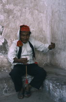 Taquile man spinning wool.