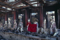 Yellow Dragon temple.  Dilapidated structure and damaged statues.TaoistTaoism